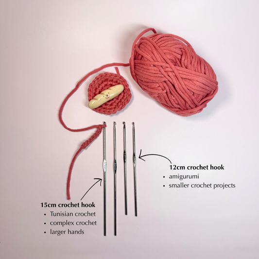 Crochet hooks and yarn on a light pink background with text indicating size and use.